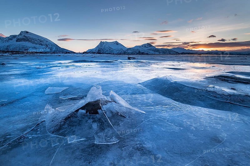Frozen fjord with broken ice