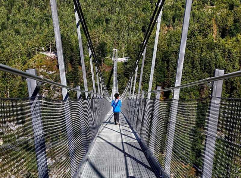 Child on suspension bridge Highline 179