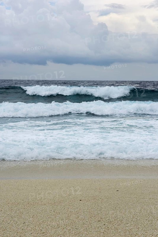 Storm and surf on the sandy beach