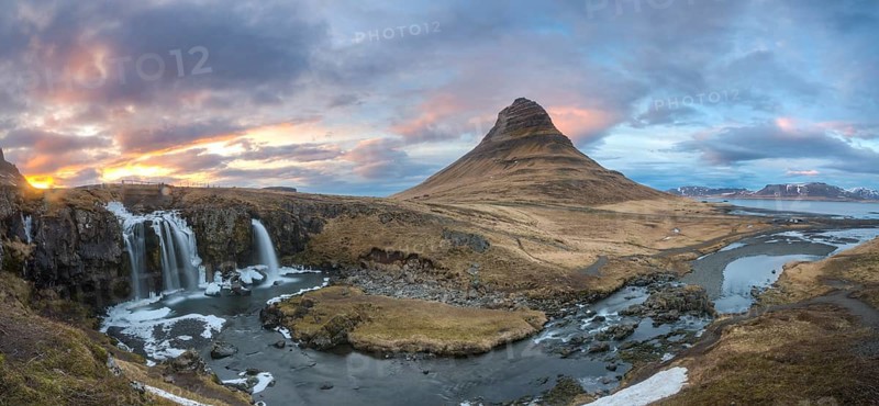 Kirkjufell mountain with Kirkjufellfoss waterfall at sunset