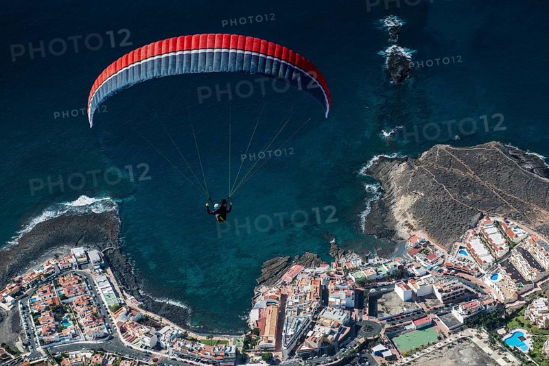 Paraglider over the Atlantic Ocean near La Caleta