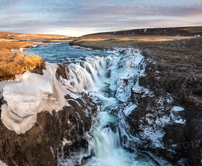 Waterfall with ice and snow in winter