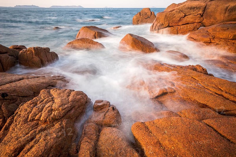 Rocks overflowed by the sea on the pink granite coast