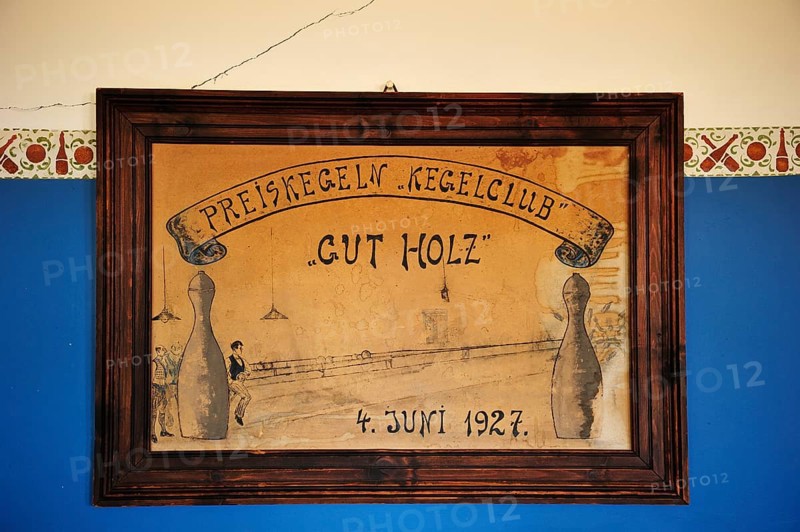 Shield of the former skittles club hanging on a wall in the former diamond town