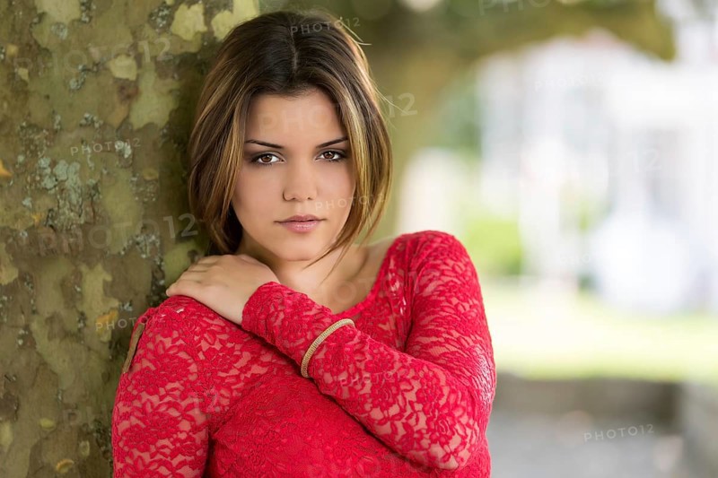 Young woman in red summer dress