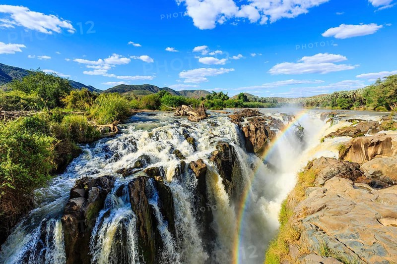 Rainbow over waterfall