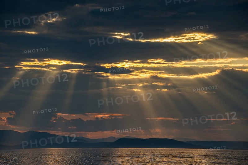 Sun breaking through the clouds above the Amur in Vladivostok