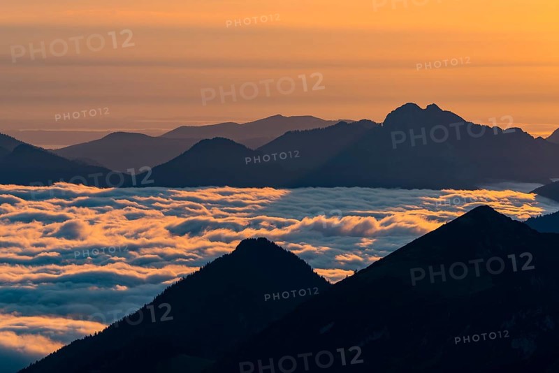 Mountain peak with sea of fog at sunrise