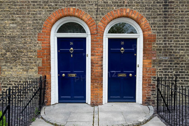 Blue front doors to townhouse