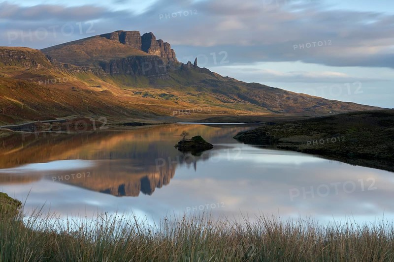 Rock formation of the Old Man of Storr with Loch Leathan
