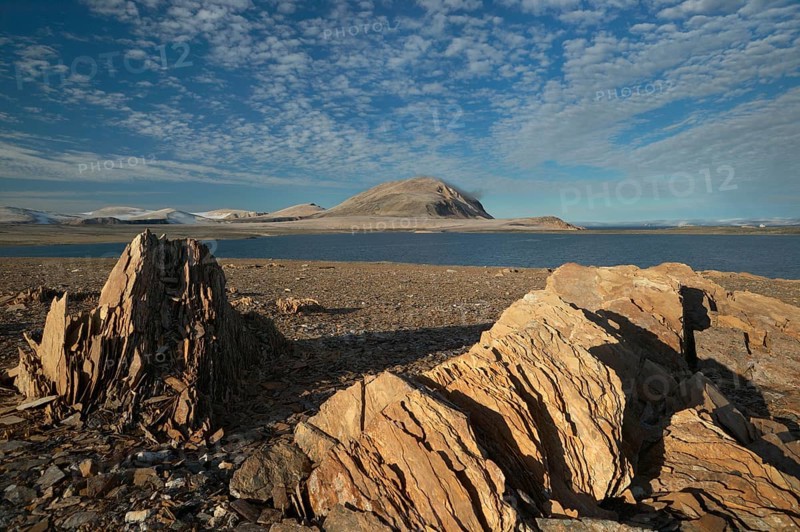 Coastal landscape and polar desert with weathered rocks in the north of the Spitsbergen archipelago