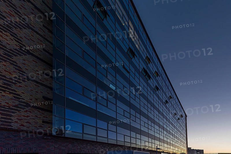 Modernized facade of the former egg cold store at dusk