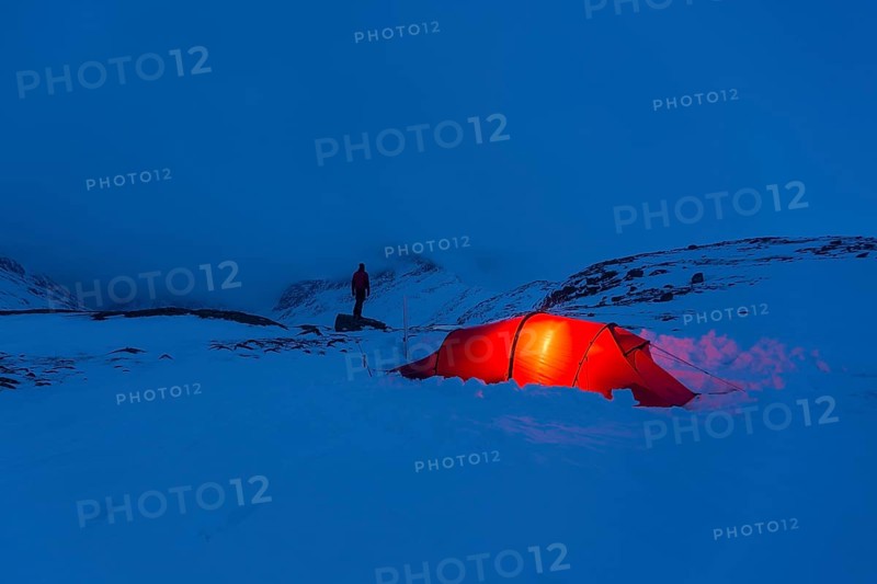 Tent with person in the snow