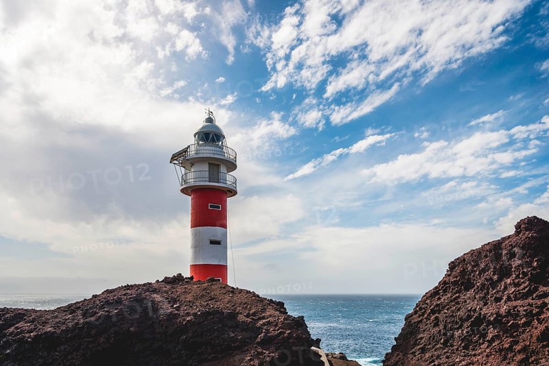 Rocky coast with lighthouse Punta de Teno