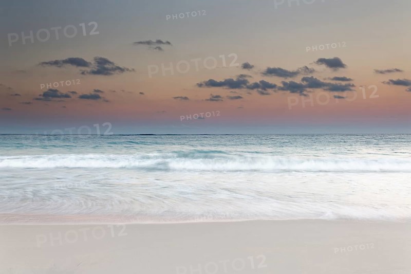 Surf during dusk over the sea