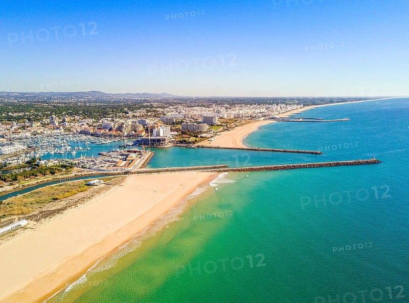 Aerial view marina and wide sandy beach