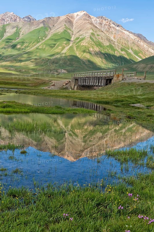 Mountains reflecting in water