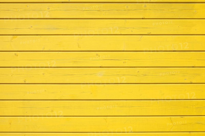 Wooden wall of horizontally arranged yellow painted boards