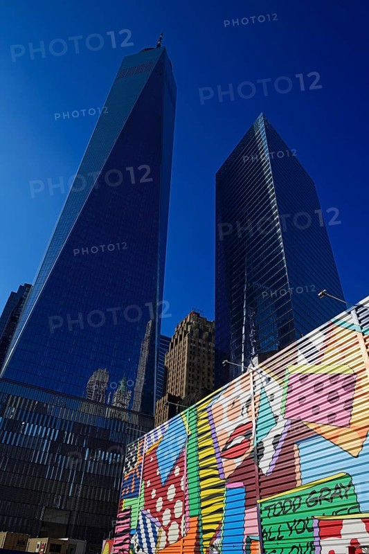 Building site with graffiti decorated walls in front of One World Trade Center Transportation Hub