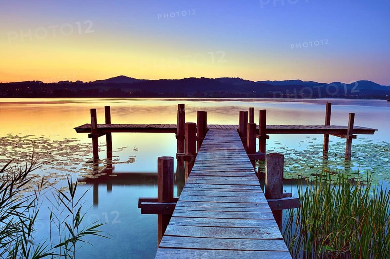 Wooden pier at sunrise on Pfaffikersee