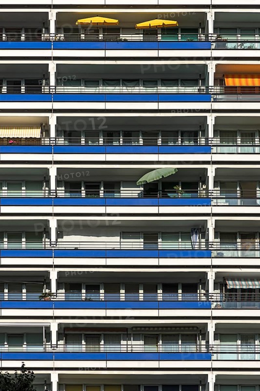 Detail of a high-rise facade with balconies on modernized prefabricated buildings
