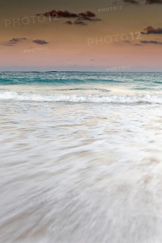 Surf during dusk over the sea