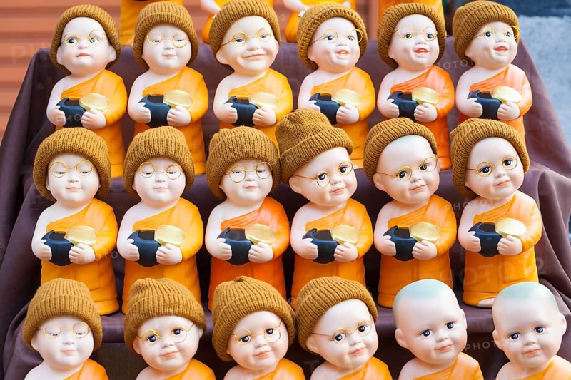 Monk toy puppets on display at the evening market