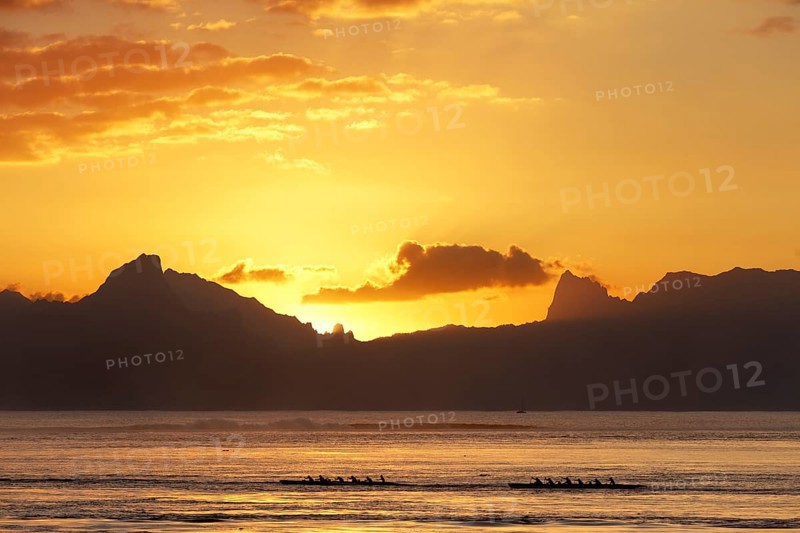 Sea kayaks on the sea at sunset