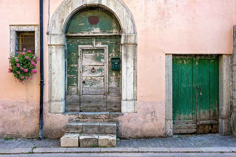 Facade with old weathered front door