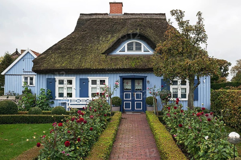 Typical blue thatched-roof house
