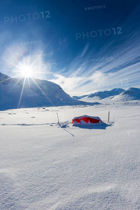 Tent with sun in the snow