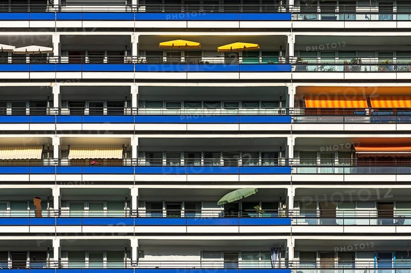 Detail of a high-rise facade with balconies on modernized prefabricated buildings