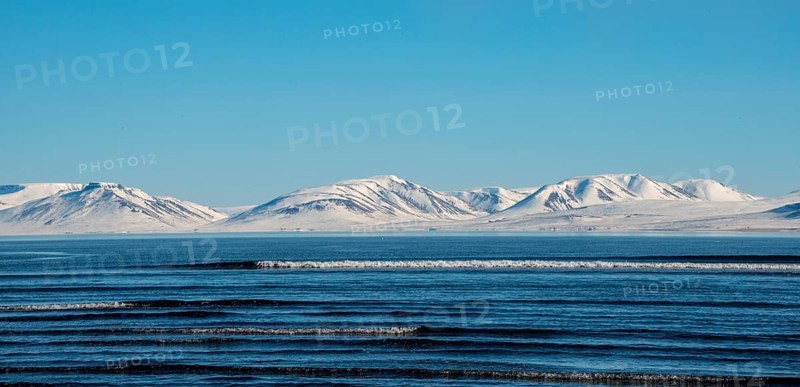 View from the peninsula Vatnsnes to sea and snow-capped mountains