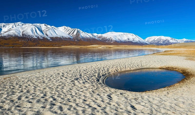 Sandy beach with pool