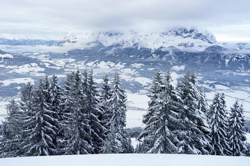 Wilder Kaiser in winter in the clouds