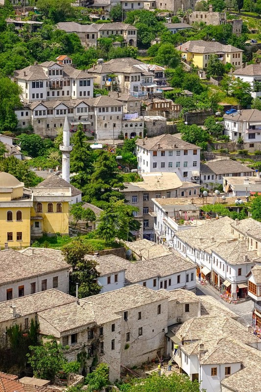 Old town with bazaar area and mountains Mali i Gjere