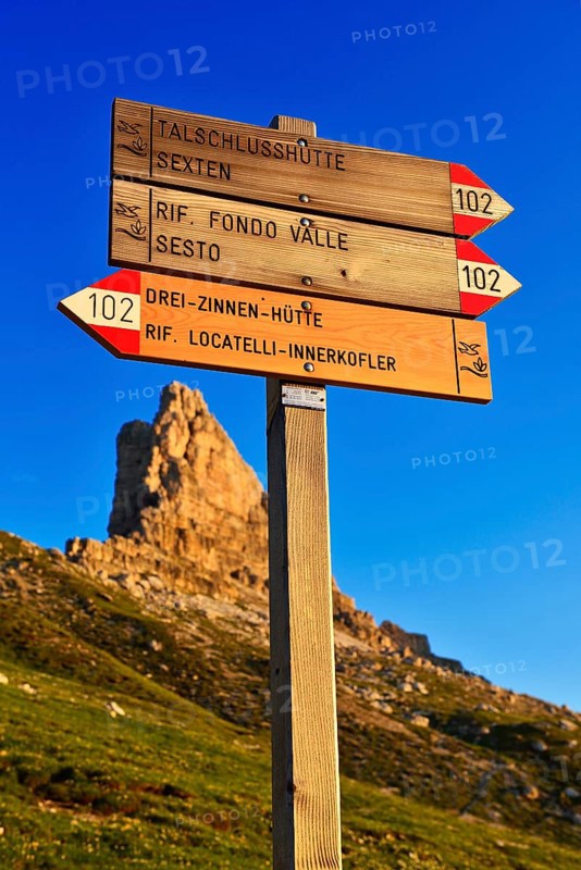 Signpost at the Three Peaks of Lavaredo mountain hut in front of the summit Toblinger Knoten