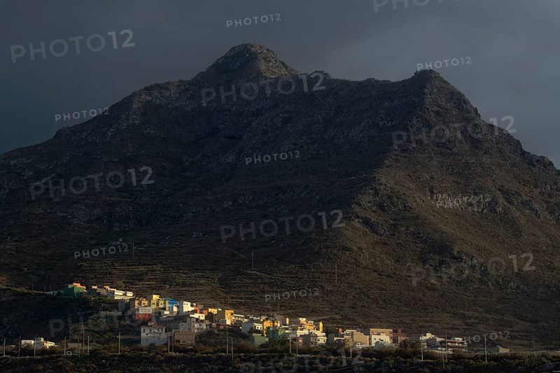 Colorful houses of Punta Hidalgo in front of Anaga Mountains