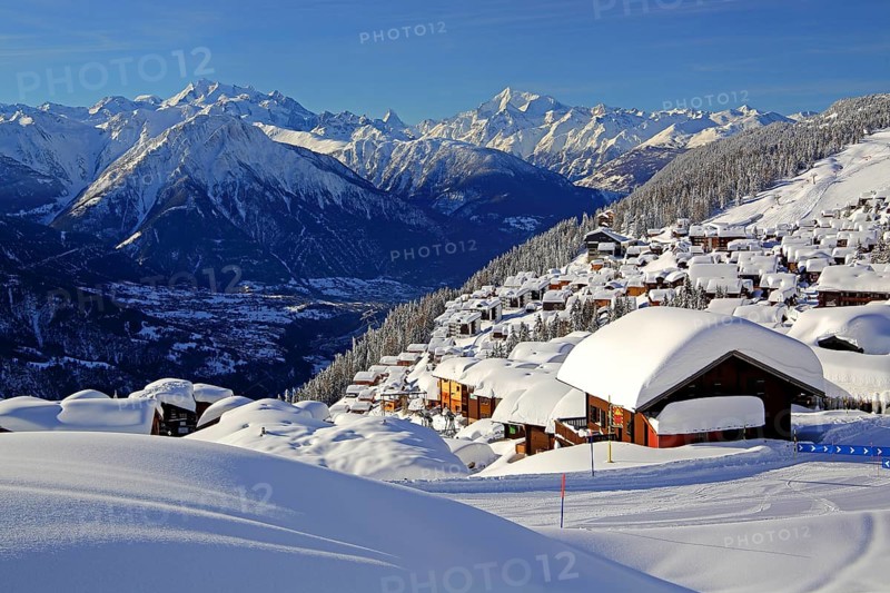 View of the village overlooking the Rhone valley with deep snowfall