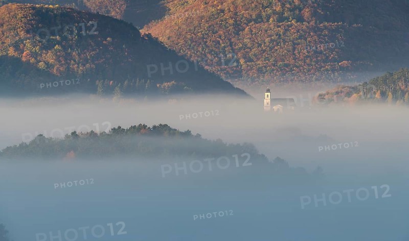 Autumn foggy atmosphere and pilgrimage church at Hafnerberg