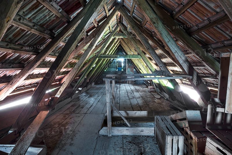 Attic with empty wooden boxes of an old farm