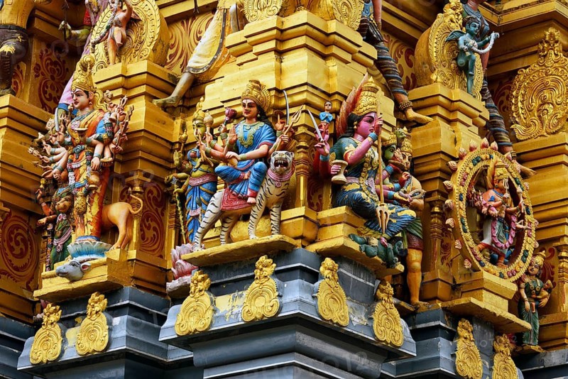 Colorful Hindu temple decorated with figures and gods