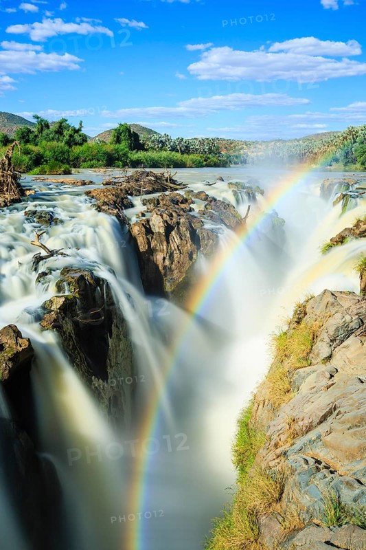 Rainbow over waterfall