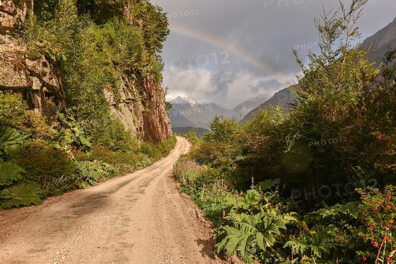 Gravel road with rainbow at Puerto Rio Tranquilo