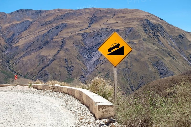 Warning sign on gravel road