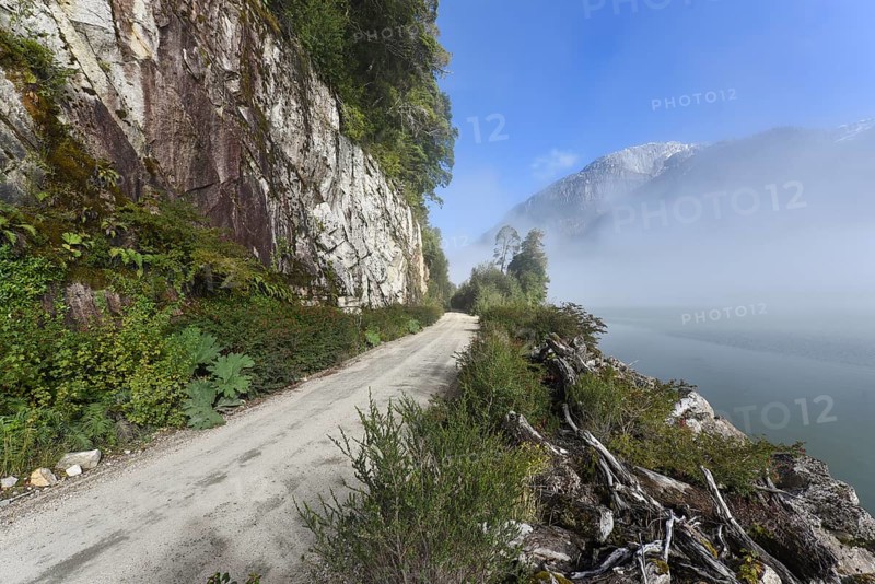 Gravel road with rainbow at Puerto Rio Tranquilo