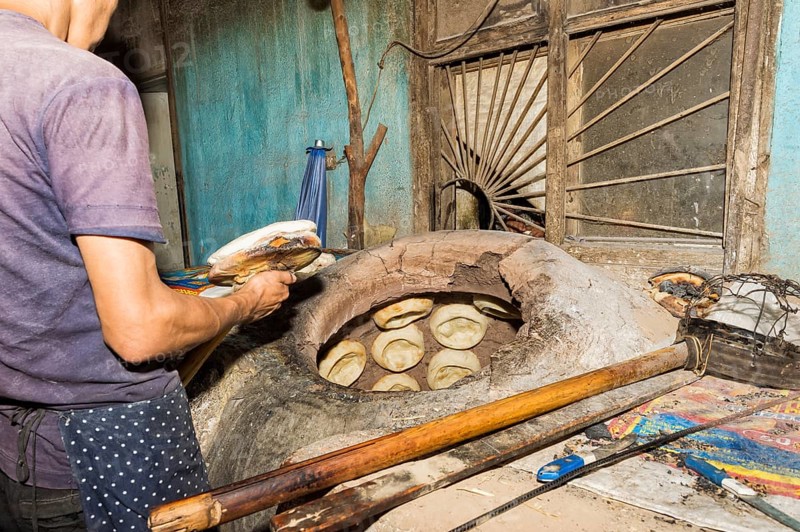 Kyrgyz man preparing the traditional Kyrgyz bread