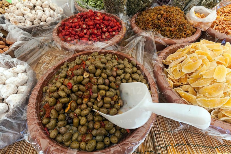 Antipasti and candied fruits at a market stall in Cannobio