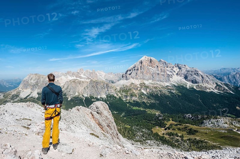 Hiker on the summit of the Averau