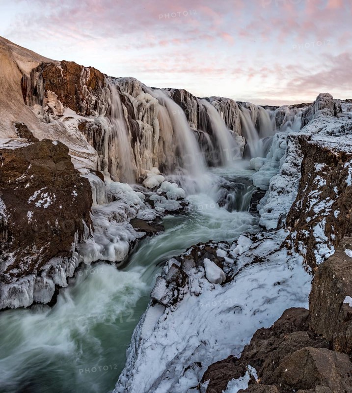 Waterfall with ice and snow in winter